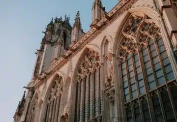 a very tall building with a clock on it's side