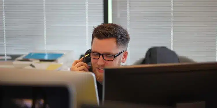 man using IP phone inside room